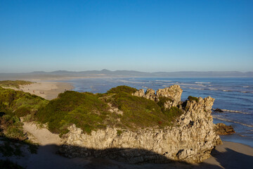 View of Grotto Beach, Klein Rivier Estuary and, in the distance across Walker Bay, the Walker Bay Nature Reserve. Hermanus, Whale Coast, Overberg, Western Cape, South Africa.