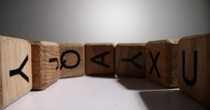 English alphabet from square wooden cubes with English alphabet. Development of thinking and grammar