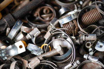 Bolts, cogs and other parts are in a mess in the garage, repair shop. Dad's day. Macrophotography.