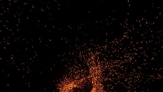 Rapid burst of sparks. Fire particles fly fast
