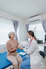 Young female doctor nurse caregiver caring happy senior grandmother helping old patients in...