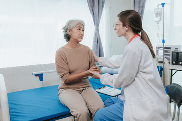 Young female doctor nurse caregiver caring happy senior grandmother helping old patients in...