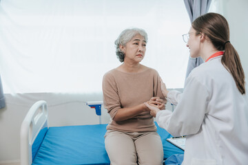 Obraz premium Young female doctor nurse caregiver caring happy senior grandmother helping old patients in rehabilitation at elderly health checkup