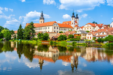 Panorama of Telč with water reflections on the lake in Telč, Czech Republic - 627358015