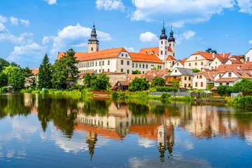 Fotobehang Panorama of Telč with water reflections on the lake in Telč, Czech Republic © PhotoFires