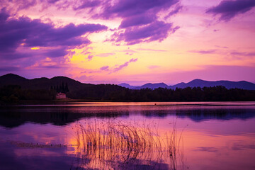 Beautiful lake in the mountains at sunset. Lake of Banyoles - Girona - Spain