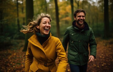 Fototapeta premium couple running through an autumn forest with happy laugh, generative artificial intelligence