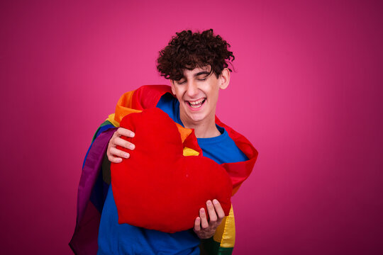 The rights of sexual minorities. A handsome guy at the gay parade with a flag.