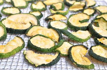 Dried zucchini slices isolated on white background