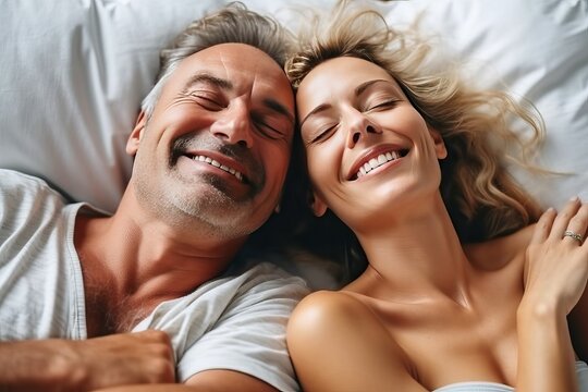 Cheerful smile couple relaxing in bed
