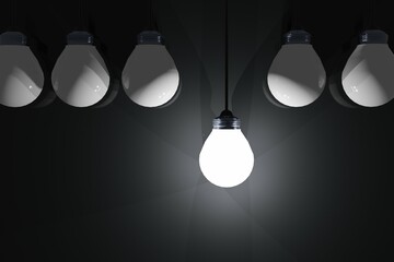light bulb on, surrounded by light bulbs off. Inspirational image, motivation.