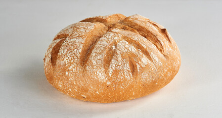 Sourdough bread on a white wooden background - isolated