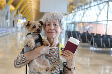 Senior woman traveling with her dog 