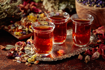 Herbal tea and a mix of various dried medicinal plants and herbs.