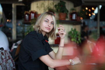 woman drinking coffee in cafe