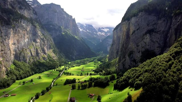 Cinematic Aerial View of Lauterbrunnen Valley with Moving Clouds Shadows. Majestic Swiss Alps Landscape . Mountain Scenery in Bernese Oberland, Switzerland.