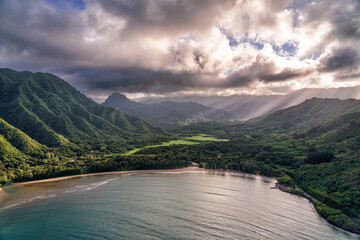 Beach along a lush rugged landscape
