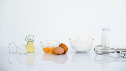 Fresh baking ingredients on kitchen table.