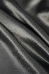 Fototapeta premium Black smooth silk texture of beauty silk