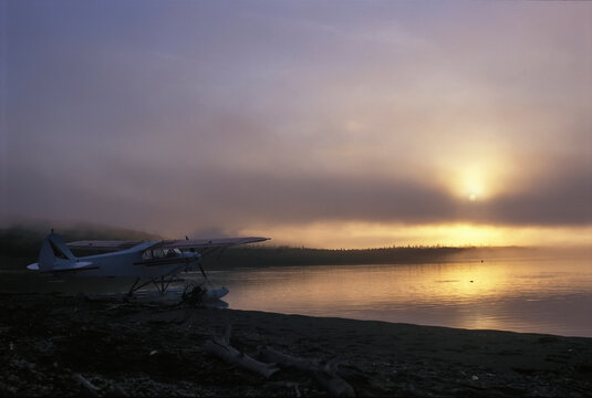 Float plane is necessary for reaching remote parts of Alaska's wilderness.  Very few roads exist in Alaska, making float plane travel a necessity; Katmai Peninsula, Alaska, United States of America