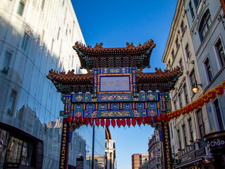 Chinatown entrance gate in traditional Chinese design in London, England, United Kingdom. "China, Peace, Security" (Zhong guo tai ping) is written on the gate in Chinese characters