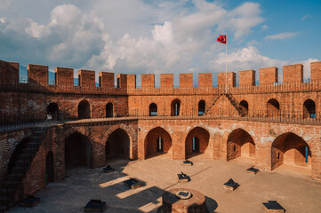 Upper part of the historical Red Tower (Kizil Kule), in Alanya Castle. The Red Tower is the symbol...