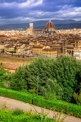 Fototapeta na wymiar Florence city. Panoramic view to the river Arno, with Ponte Vecchio, Palazzo Vecchio and Cathedral of Santa Maria del Fiore (Duomo), Florence, Italy