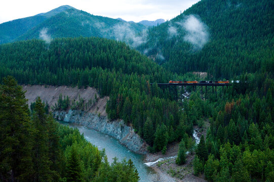 Train crosses a bridge in the Walton area of Glacier National Park, Montana, USA; Montana, United States of America