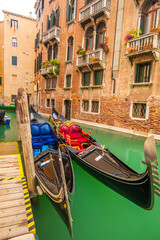 Fototapeta na wymiar Beautiful view of a canal in Venice with gondolas, Venice, Italy, Europe.