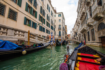 Beautiful view of a canal in Venice with gondolas, Venice, Italy, Europe.