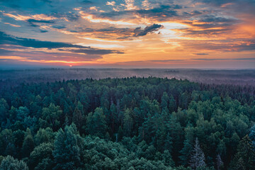 Beautiful sunset over the forest from above 
