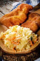 Two fried cod fillet pieces.