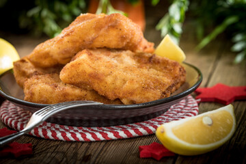 Fried cod slices in breadcrumbs.