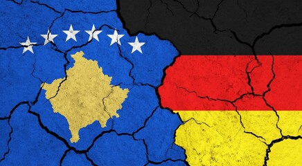 Flags of Kosovo and Germany on cracked surface - politics, relationship concept