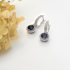 Elegant jewelry set. Jewellery set with gemstones. Jewelry accessories collage. Product still life concept. Ring, necklace and earrings.