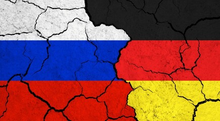 Flags of Russia and Germany on cracked surface - politics, relationship concept