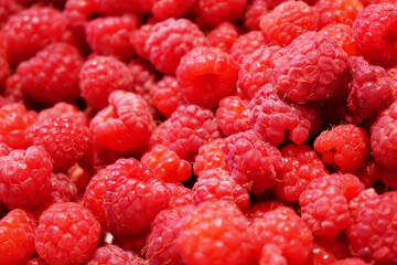 Raspberries. Fresh juicy raspberries bright background. Sweet raspberry