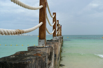 wooden fence on the beach