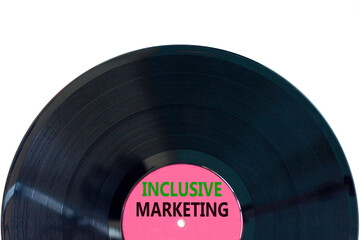 Inclusive marketing symbol. Concept words Inclusive marketing on beautiful black purple vynil disk. Beautiful white table white background. Business inclusive marketing concept. Copy space.