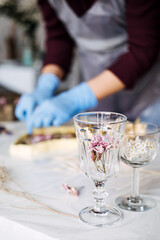 Side hustle, Money-Making Crafts, DIY Crafts To Create and Make Money. Epoxy Resin Art. Creating Art with Resin on workshop. The art process of creating epoxy resin handmade staff in art studio.