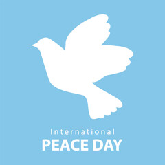 International Day of Peace, postcard. White dove on a blue background, vector. Silhouette of a white dove on a blue background and the inscription INTERNATIONAL PEACE DAY.