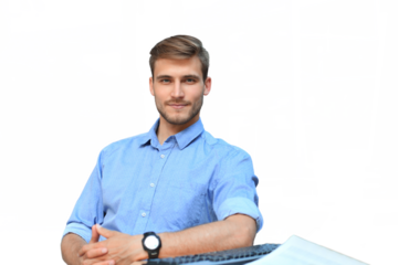 Portrait of happy man sitting at office desk, looking at camera, smiling on a transparent background