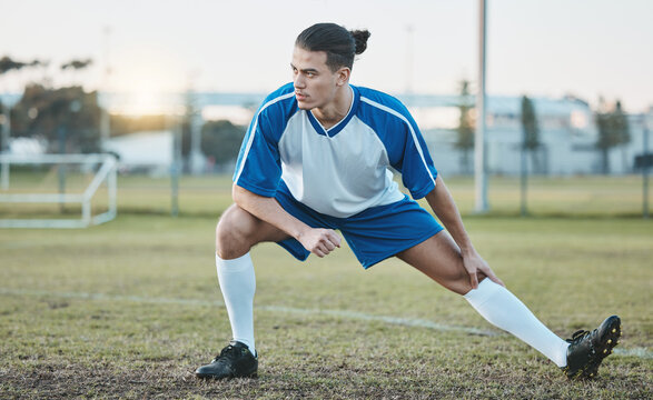 Thinking, sports or soccer player stretching legs on football field in training, exercise or workout in Brazil, Fitness, warm up or serious male athlete ready to start practice match or stadium game