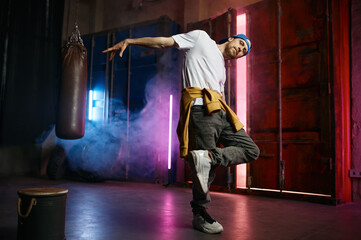 Cool Hip hop dancer in trendy street clothes dancing