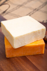 British cheeses collection, Scottish coloured and English matured cheddar cheeses close up