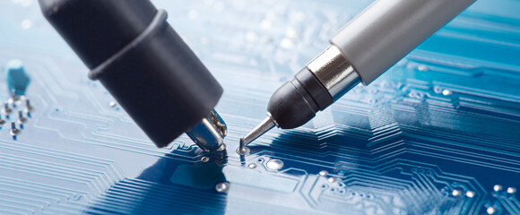 Measuring electronic signal using oscilloscope on the PCB. Electronics repair and digital...