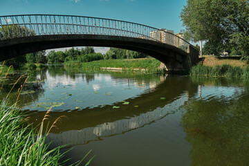 Bow bridge in Central park at spring sunny day