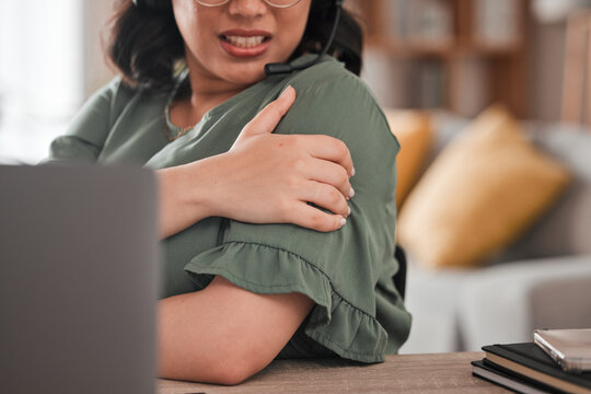 Woman, hands and shoulder pain in remote work from injury, stress or burnout at home office. Closeup of female person freelancer with sore arm, ache or inflammation in discomfort, mistake or accident