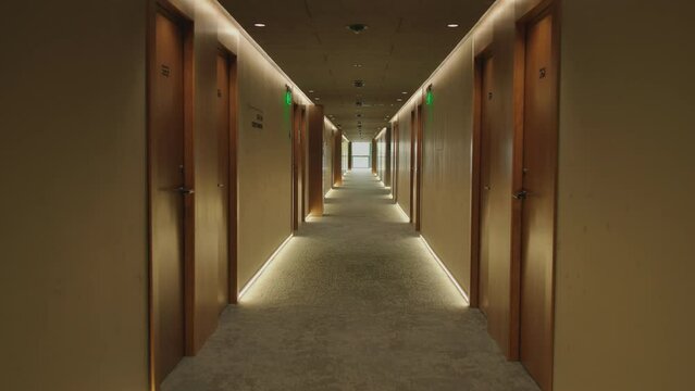 Footage of empty hotel corridor in modern hall with gorgeous interior. Sophisticated and luxury atmosphere. Aesthetic concept. Tranquility and elegance. Indoors. Daytime