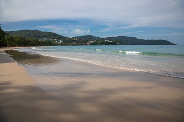 Beautiful beach on a summer day. Blue sky. Sunny day. Yellow sand on the beach.